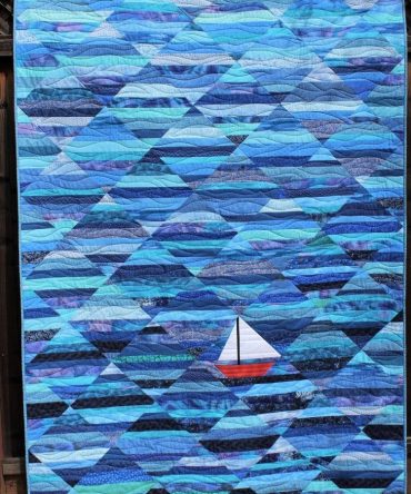 Red Boat Blue Sea Quilted Blanket
